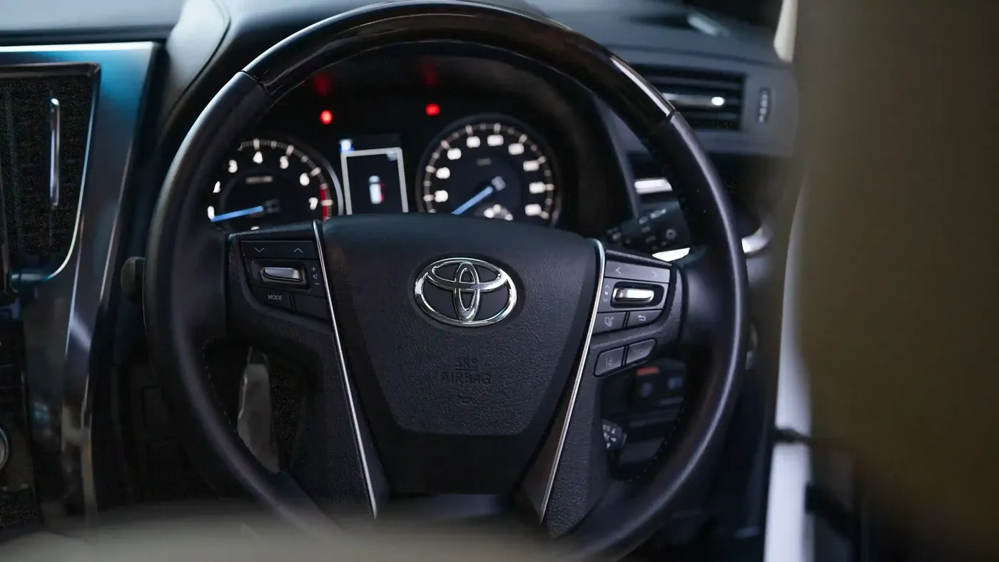 The steering wheel and instrument panel of a Toyota Alphard