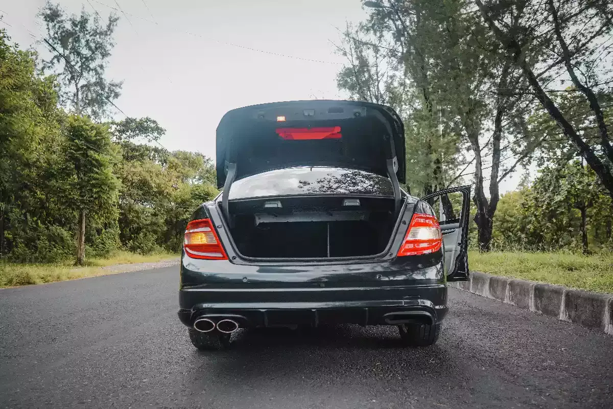 A Mercedes-Benz sedan with its boot open