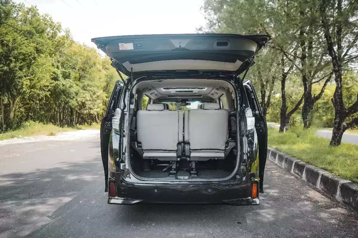 A Vellfire with its tailgate open, showing the luggage space