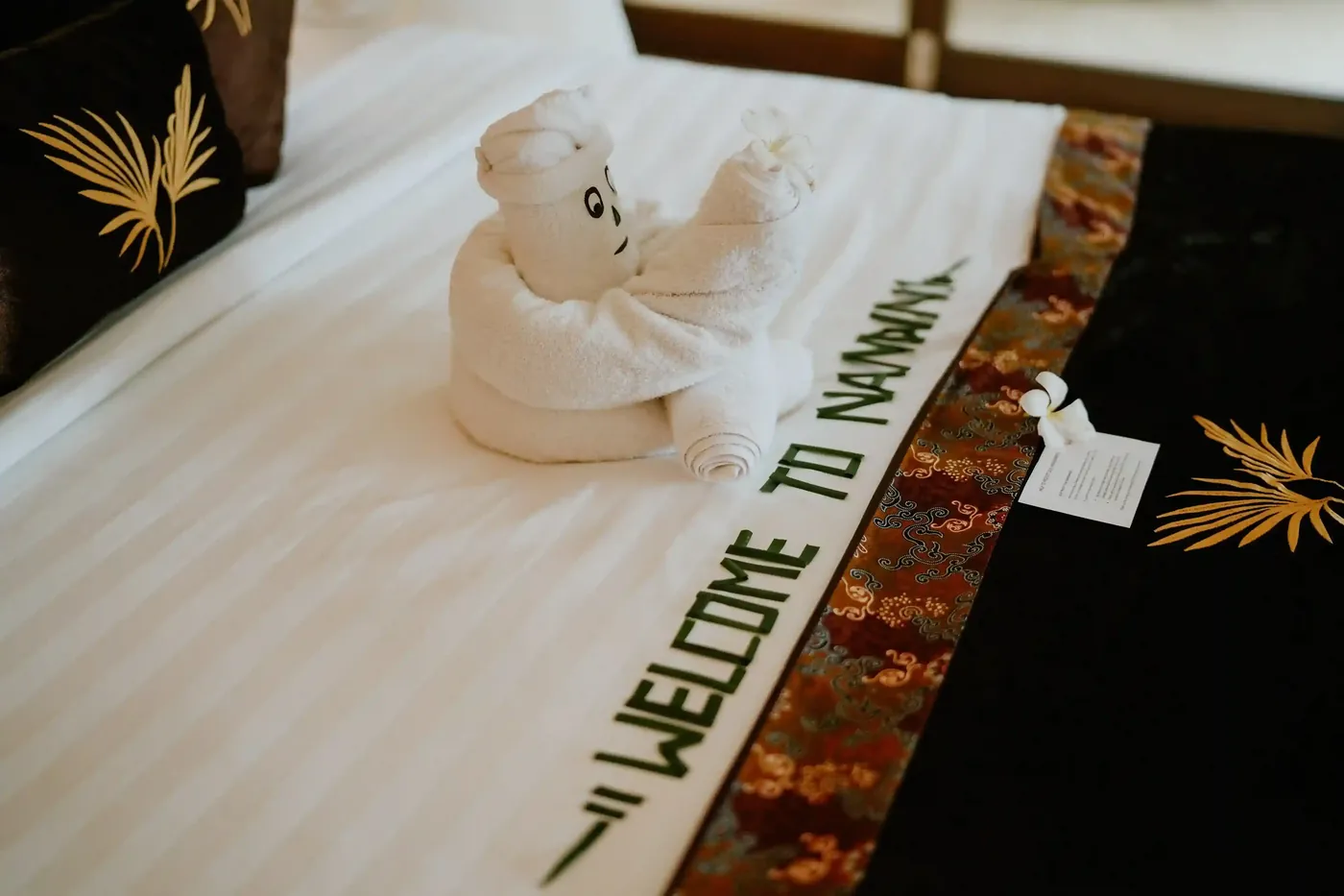 A welcome towel arrangement on a villa bed in Bali